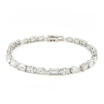 18K White Gold, Fancy Shape, Baguette, Pear, and Oval-Cut Tennis Bracelet
Crafted in 18K White Gold, this exquisite tennis bracelet showcases an alternating pattern of Baguette, Pear, and Oval-Cut Lab-Grown Diamonds. Meticulous craftsmanship shines through each prong-set facet, delivering a rhythmic, multidimensional sparkle from every angle. This modern blend of three shapes creates a timeless yet contemporary elegance, perfect for elevating moments that deserve to shine.