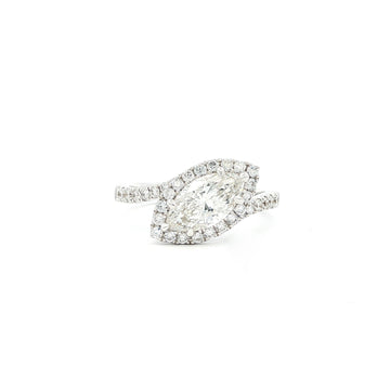 This 18K White Gold features a Marquise centre with a perfectly studded halo. The band enhances the centre diamond, creating an unforgettable piece! 