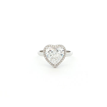 Crafted in 18K White Gold, this ring features a brilliant heart-shaped lab-grown diamond embraced by a glittering halo. Beneath the centre stone, a hidden halo adds an extra tier of light, the double-halo effect creates depth and radiance, making this ring a true statement of elegance.