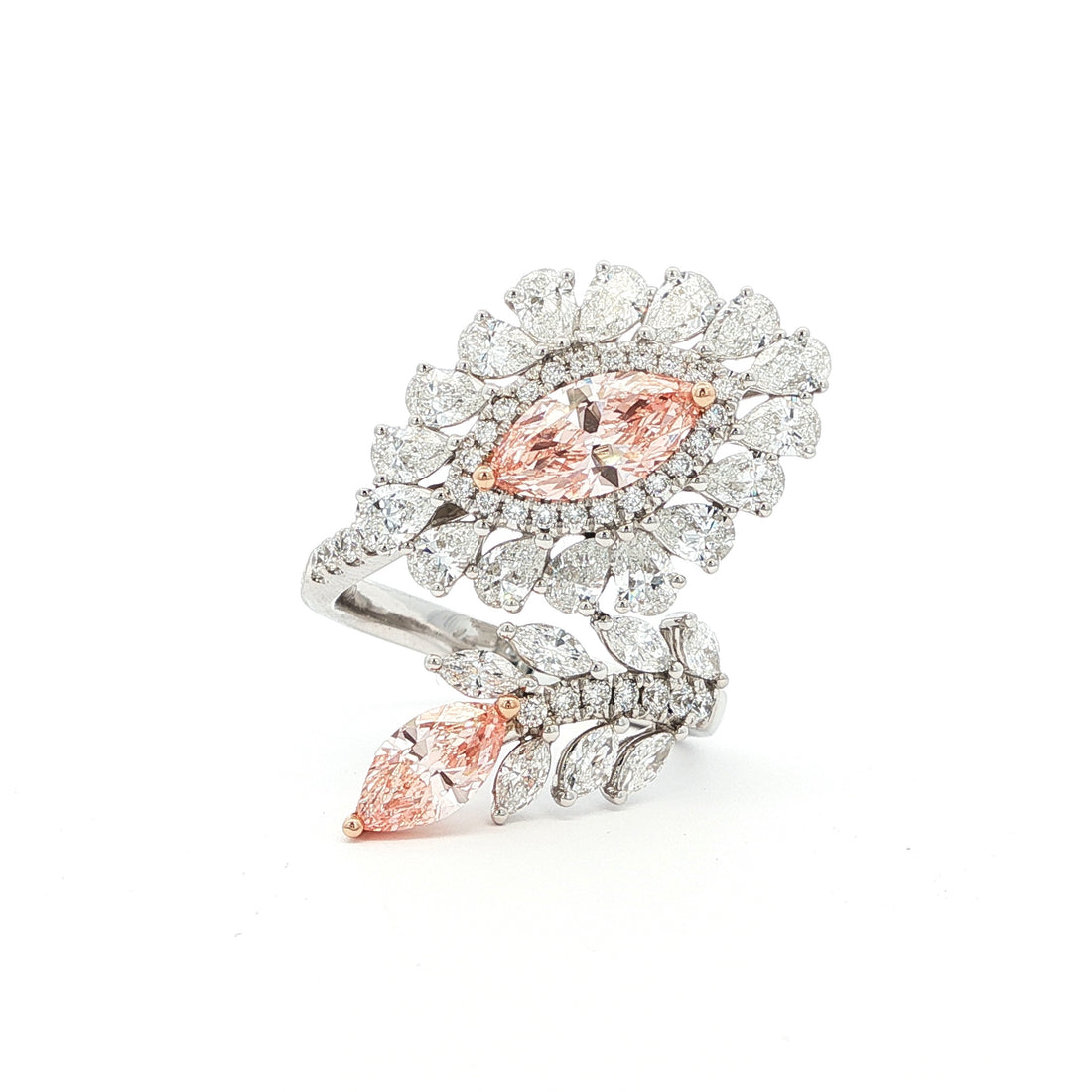 This 14K White Gold ring features an exquisite floral design, adorned with white diamond "petals" and a stunning pink oval-cut diamond at its centre. Crafted with precision, this ring makes the perfect statement piece for any occasion! 