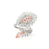 This 14K White Gold ring features an exquisite floral design, adorned with white diamond "petals" and a stunning pink oval-cut diamond at its centre. Crafted with precision, this ring makes the perfect statement piece for any occasion! 