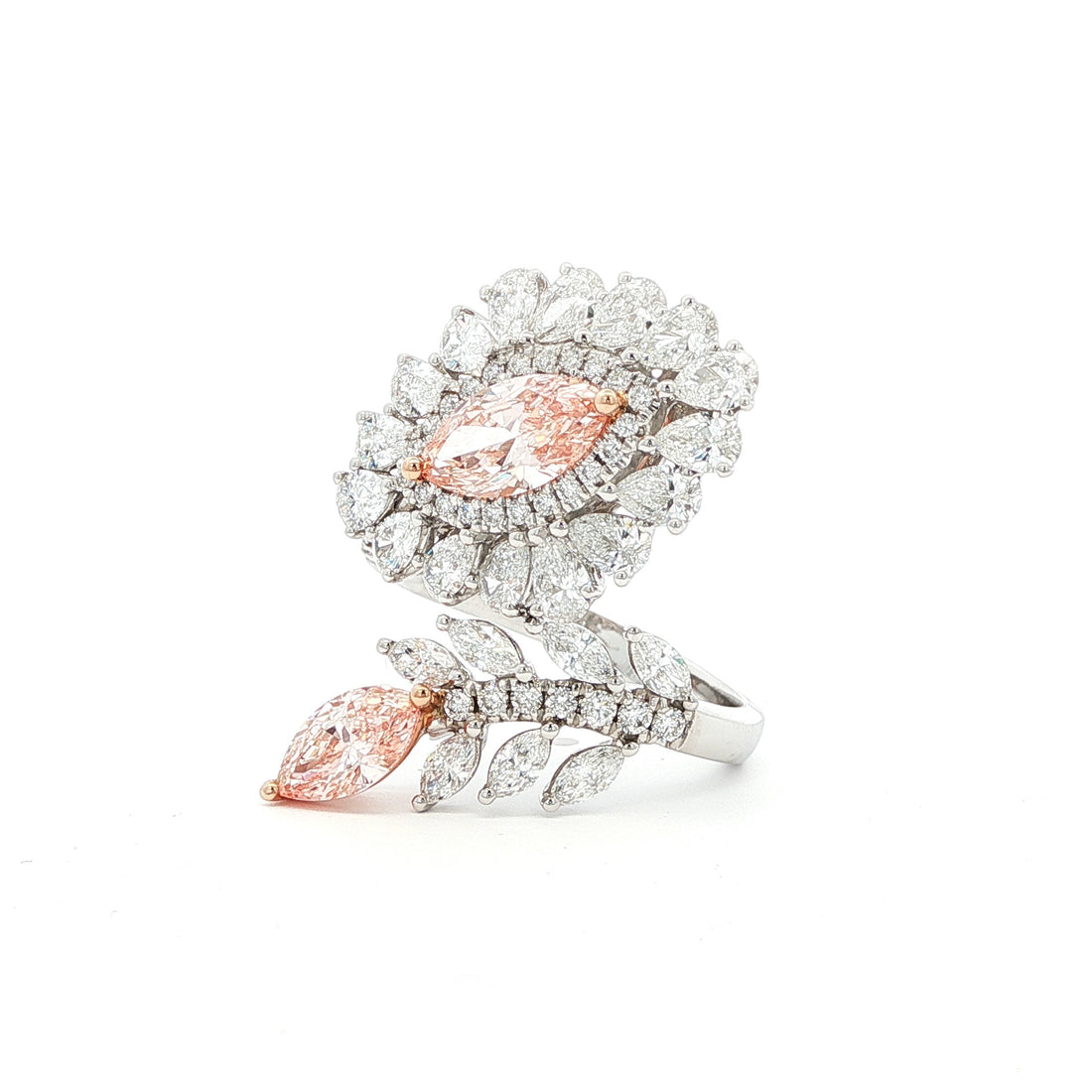 This 14K White Gold ring features an exquisite floral design, adorned with white diamond "petals" and a stunning pink oval-cut diamond at its centre. Crafted with precision, this ring makes the perfect statement piece for any occasion! 