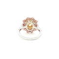 This 18KT Yellow Gold ring showcases a vibrant center of brilliant yellow diamonds, elegantly encircled by a halo of pink and white diamonds. The bold contrasts of colors create a captivating play of light, making it a true statement piece for any occasion.