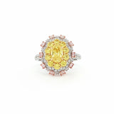 This 18KT Yellow Gold ring showcases a vibrant center of brilliant yellow diamonds, elegantly encircled by a halo of pink and white diamonds. The bold contrasts of colors create a captivating play of light, making it a true statement piece for any occasion.