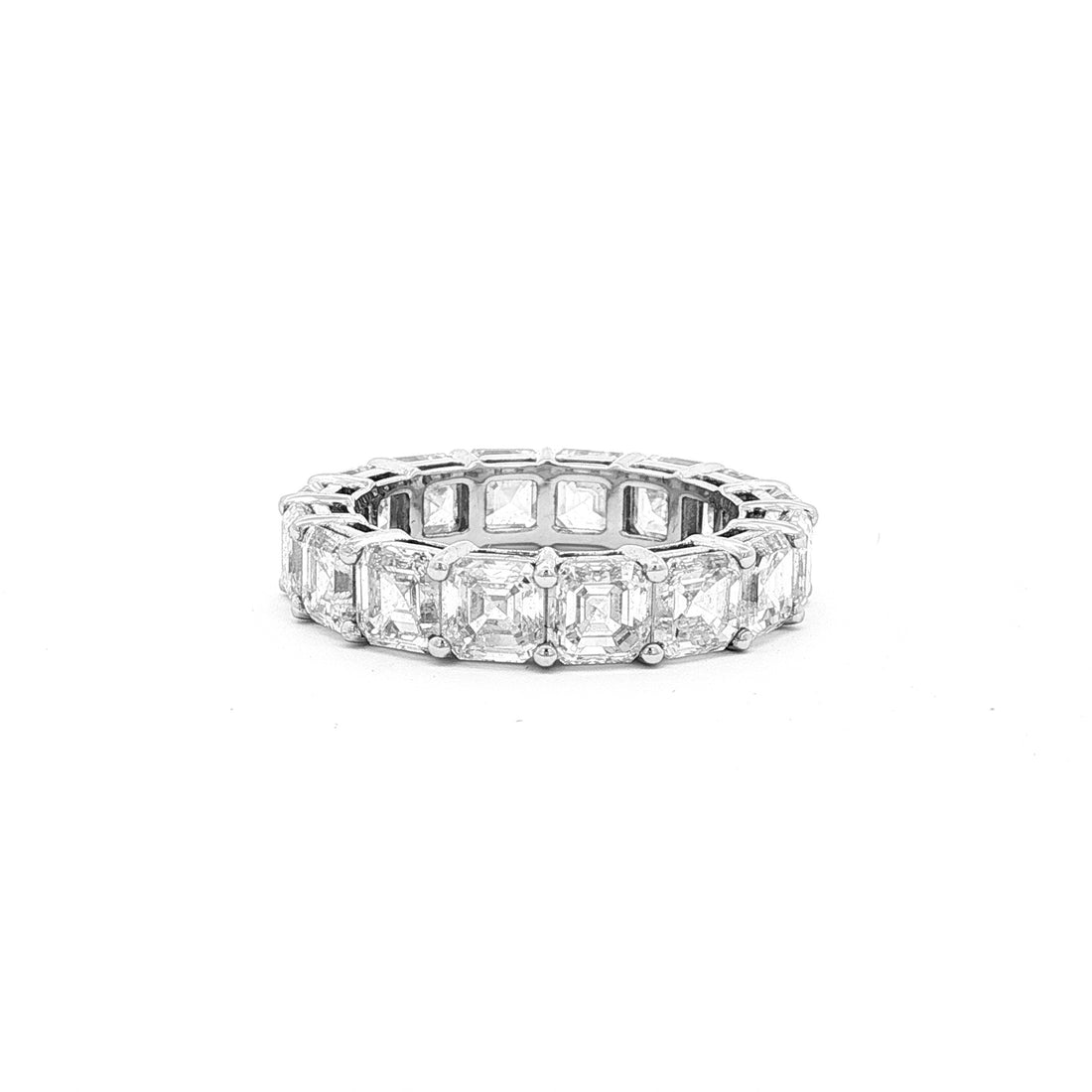 This 18K White Gold eternity ring embodies timeless sophistication, showcasing expertly step-cut Asscher diamonds. The seamless design ensures continuous sparkle and a luxurious feel, making it a perfect symbol of everlasting commitment and refined style.