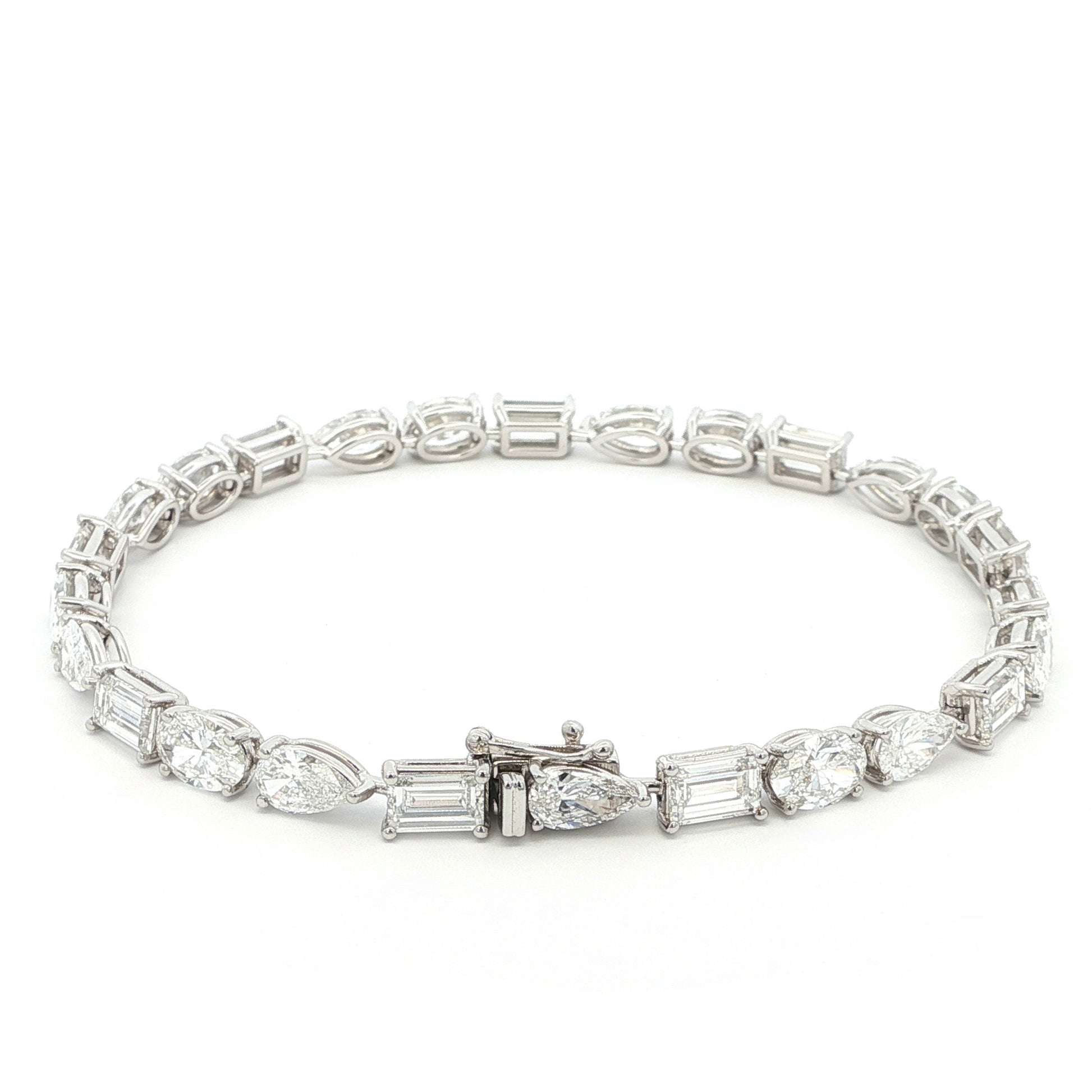 18K White Gold, Fancy Shape, Baguette, Pear, and Oval Cut Tennis Bracelet 

Crafted in 18K White Gold, this exquisite tennis bracelet showcases an alternating pattern of Baguette, Pear, and Oval-Cut Lab-Grown Diamonds. Meticulous craftsmanship shines through each prong-set facet, delivering a rhythmic, multidimensional sparkle from every angle. This modern blend of three shapes creates a timeless yet contemporary elegance, perfect for elevating moments that deserve to shine. 