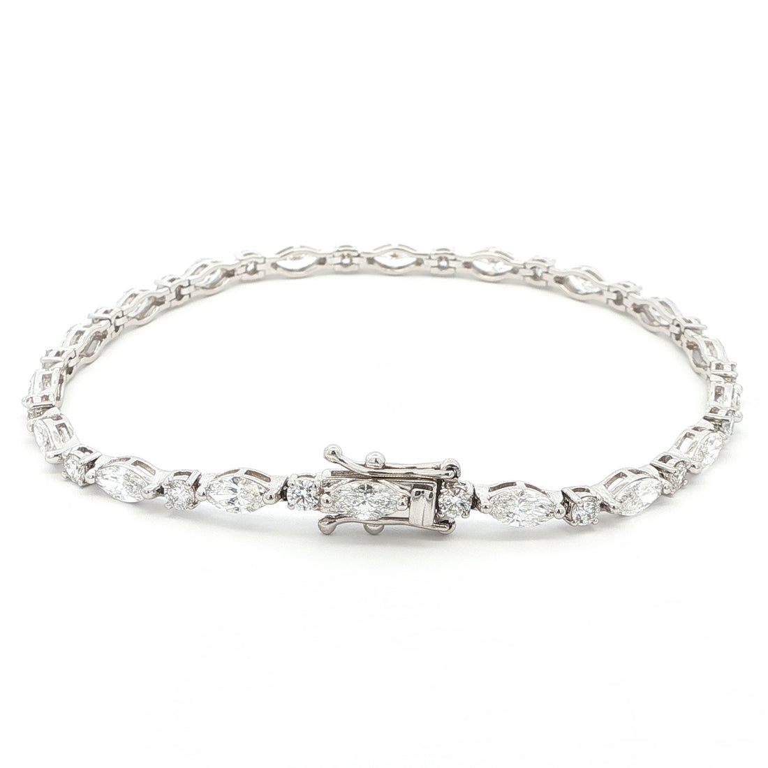18K White Gold Marquise and Round Cut Lab Grown Diamond Bracelet 

A modern take on the classic tennis bracelet. This 18K White Gold bracelet features marquise and round-cut diamonds in a clean geometric design. The contrast of shapes creates subtle movement and light play.