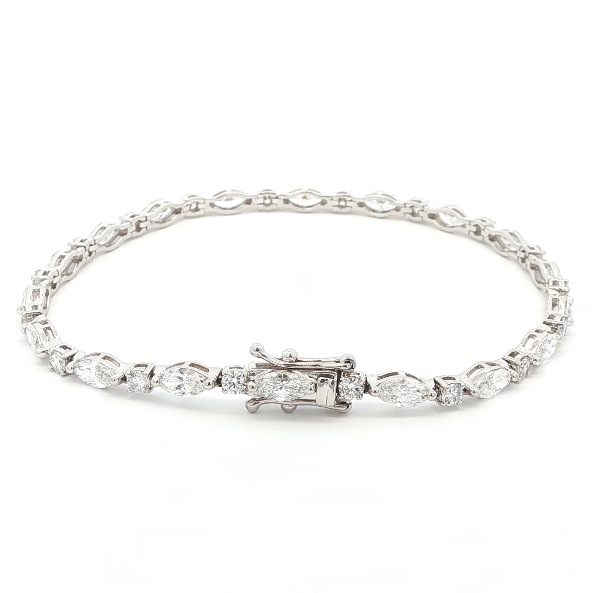 18K White Gold Marquise and Round Cut Lab Grown Diamond Bracelet 

A modern take on the classic tennis bracelet. This 18K White Gold bracelet features marquise and round-cut diamonds in a clean geometric design. The contrast of shapes creates subtle movement and light play.