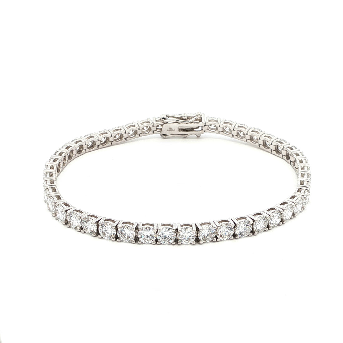 18K White Gold Brilliant Round Cut Lab-Grown Diamond Tennis Bracelet. 

This 18K White Gold is the ultimate classic—endless rounds of brilliant-cut diamonds set in a seamless flow of sparkle. Perfect for those who appreciate timeless elegance with effortless versatility.