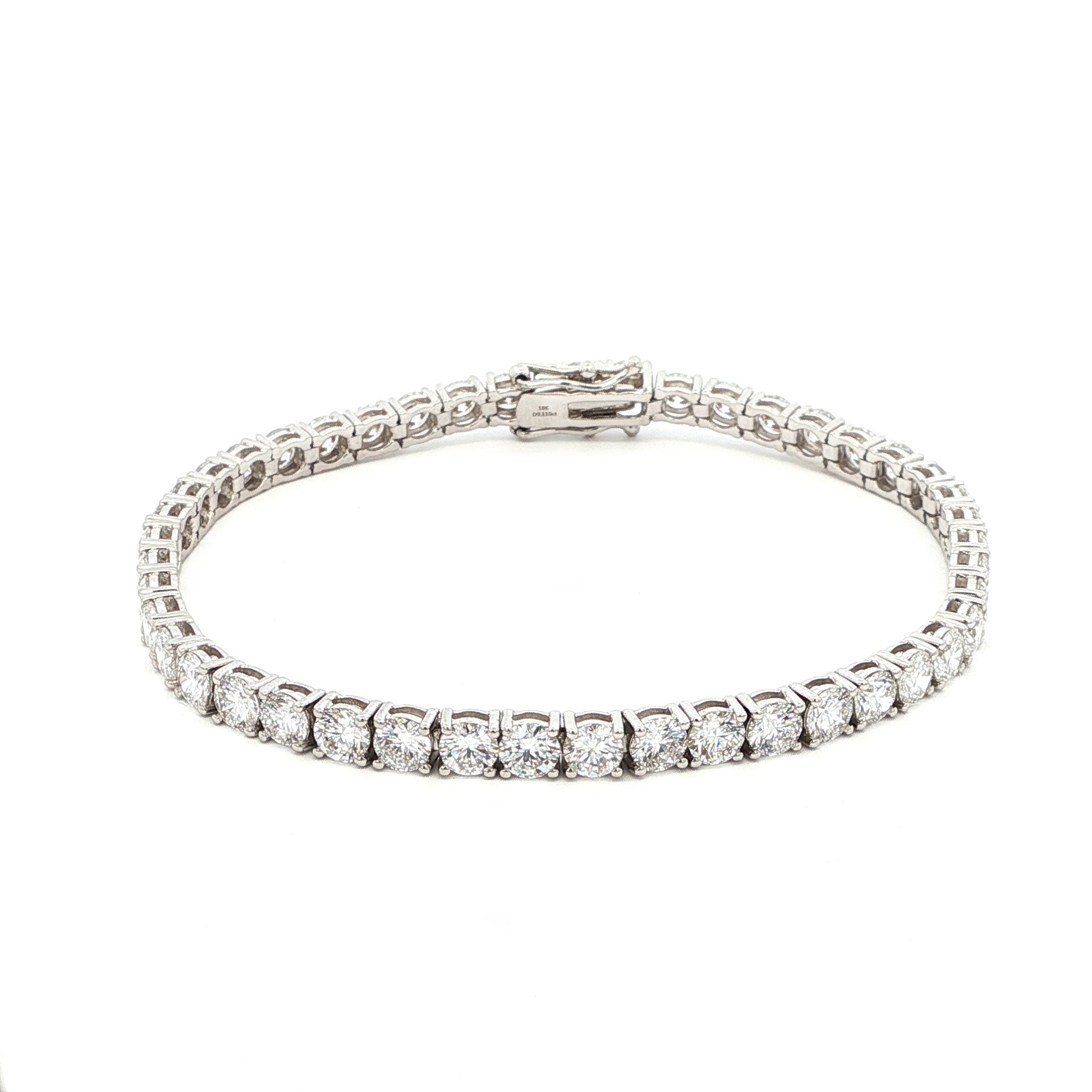 18K White Gold Brilliant Round Cut Lab-Grown Diamond Tennis Bracelet. 

This 18K White Gold is the ultimate classic—endless rounds of brilliant-cut diamonds set in a seamless flow of sparkle. Perfect for those who appreciate timeless elegance with effortless versatility.