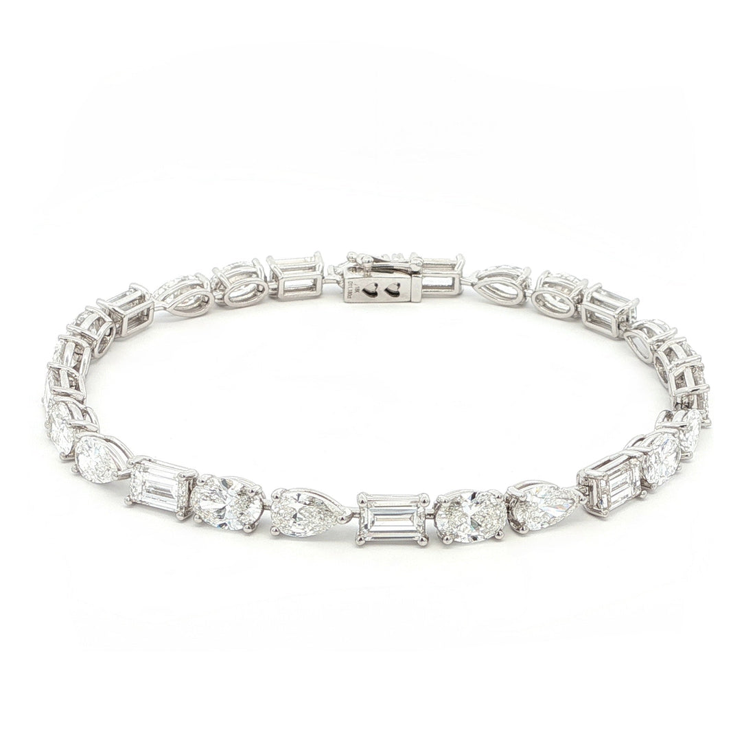 18K White Gold, Fancy Shape, Baguette, Pear, and Oval-Cut Tennis Bracelet 

Crafted in 18K White Gold, this exquisite tennis bracelet showcases an alternating pattern of Baguette, Pear, and Oval-Cut Lab-Grown Diamonds. Meticulous craftsmanship shines through each prong-set facet, delivering a rhythmic, multidimensional sparkle from every angle. This modern blend of three shapes creates a timeless yet contemporary elegance, perfect for elevating moments that deserve to shine. 