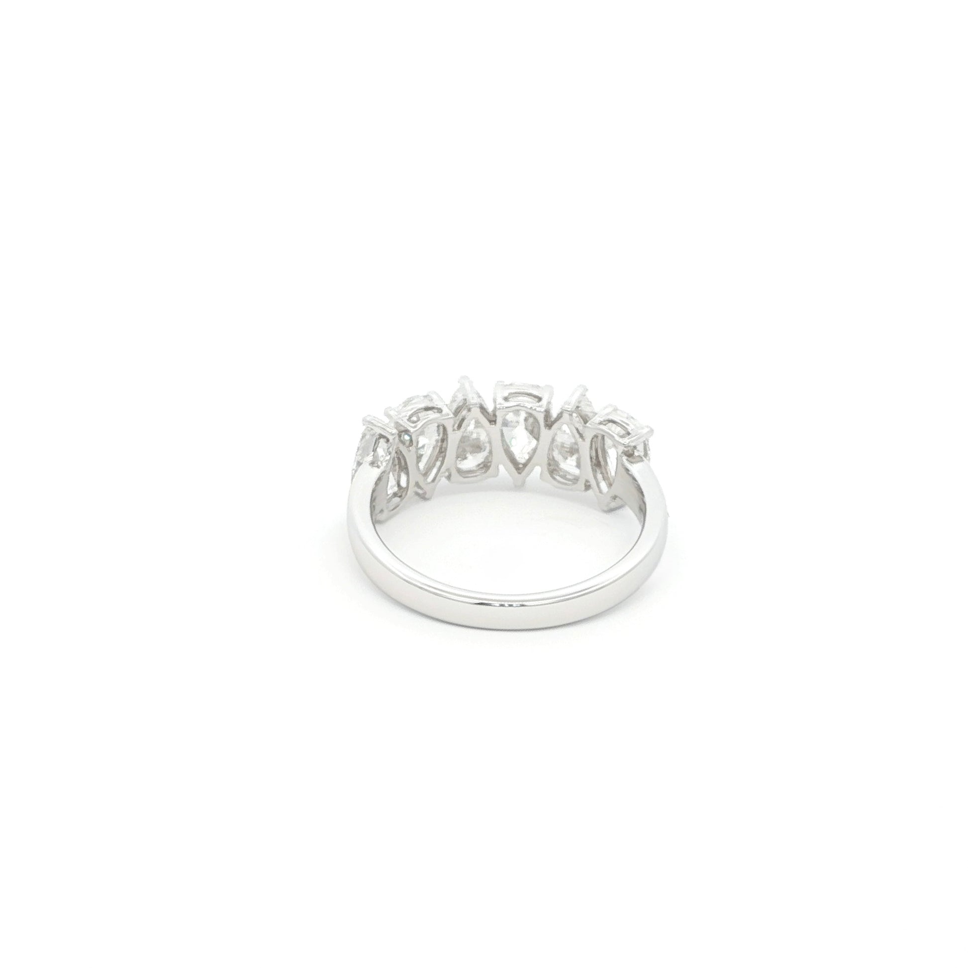 Pear cut lab grown diamond ring in half eternity style, 18k white gold.