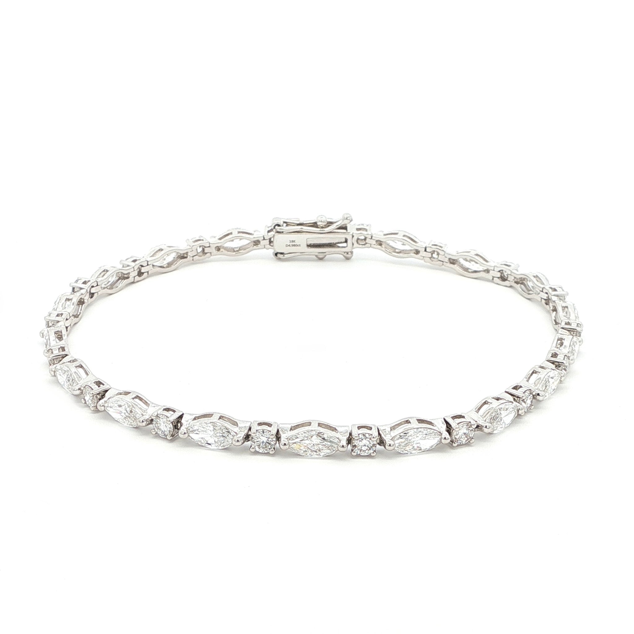 18K White Gold Marquise and Round Cut Lab Grown Diamond Bracelet 

A modern take on the classic tennis bracelet. This 18K White Gold bracelet features marquise and round-cut diamonds in a clean geometric design. The contrast of shapes creates subtle movement and light play.