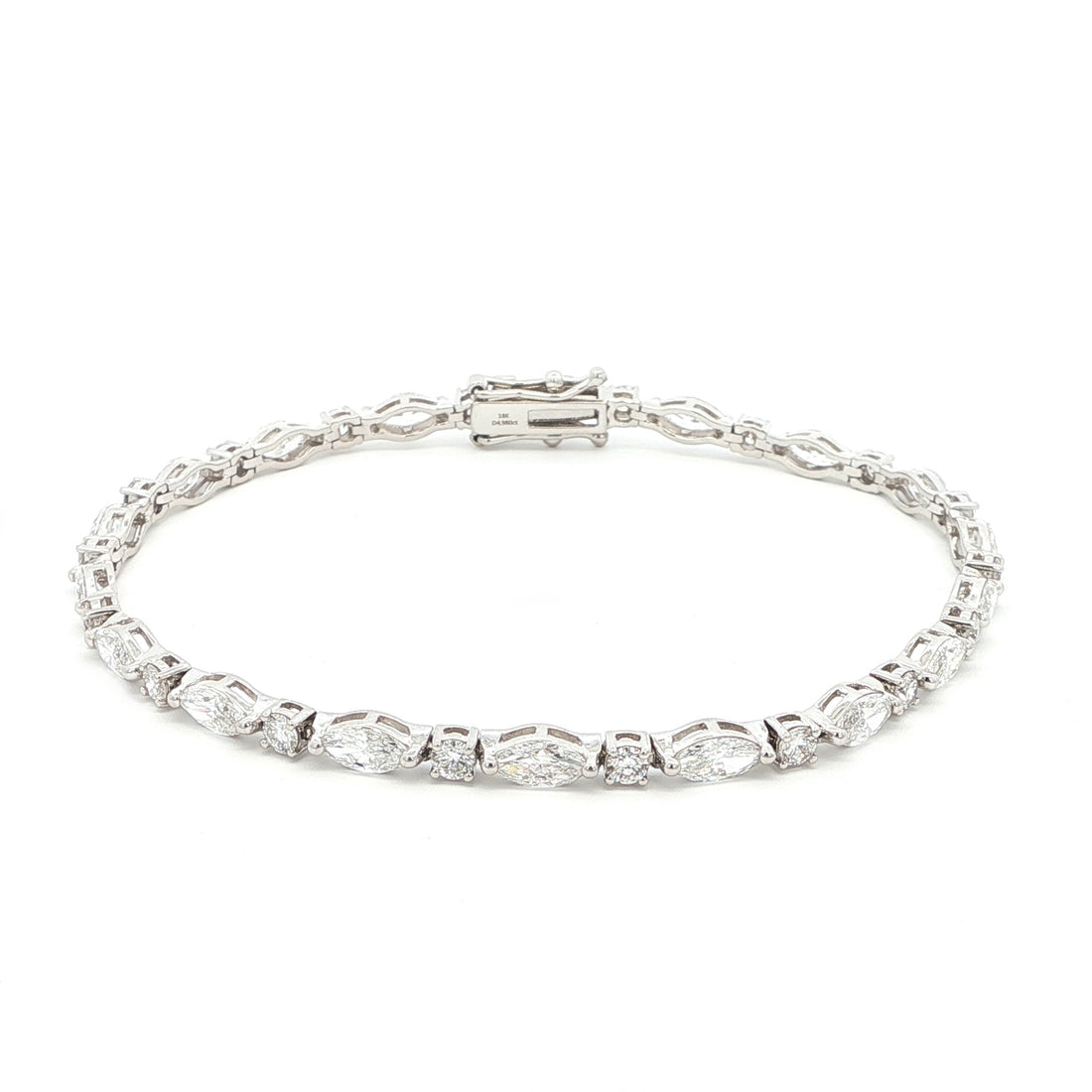 18K White Gold Marquise and Round Cut Lab Grown Diamond Bracelet 

A modern take on the classic tennis bracelet. This 18K White Gold bracelet features marquise and round-cut diamonds in a clean geometric design. The contrast of shapes creates subtle movement and light play.