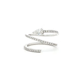 This 18K White Gold ring showcases a pear-cut diamond, set in a serpent-shaped band adorned with sparkling diamonds. A timeless design with a touch of modern artistry!