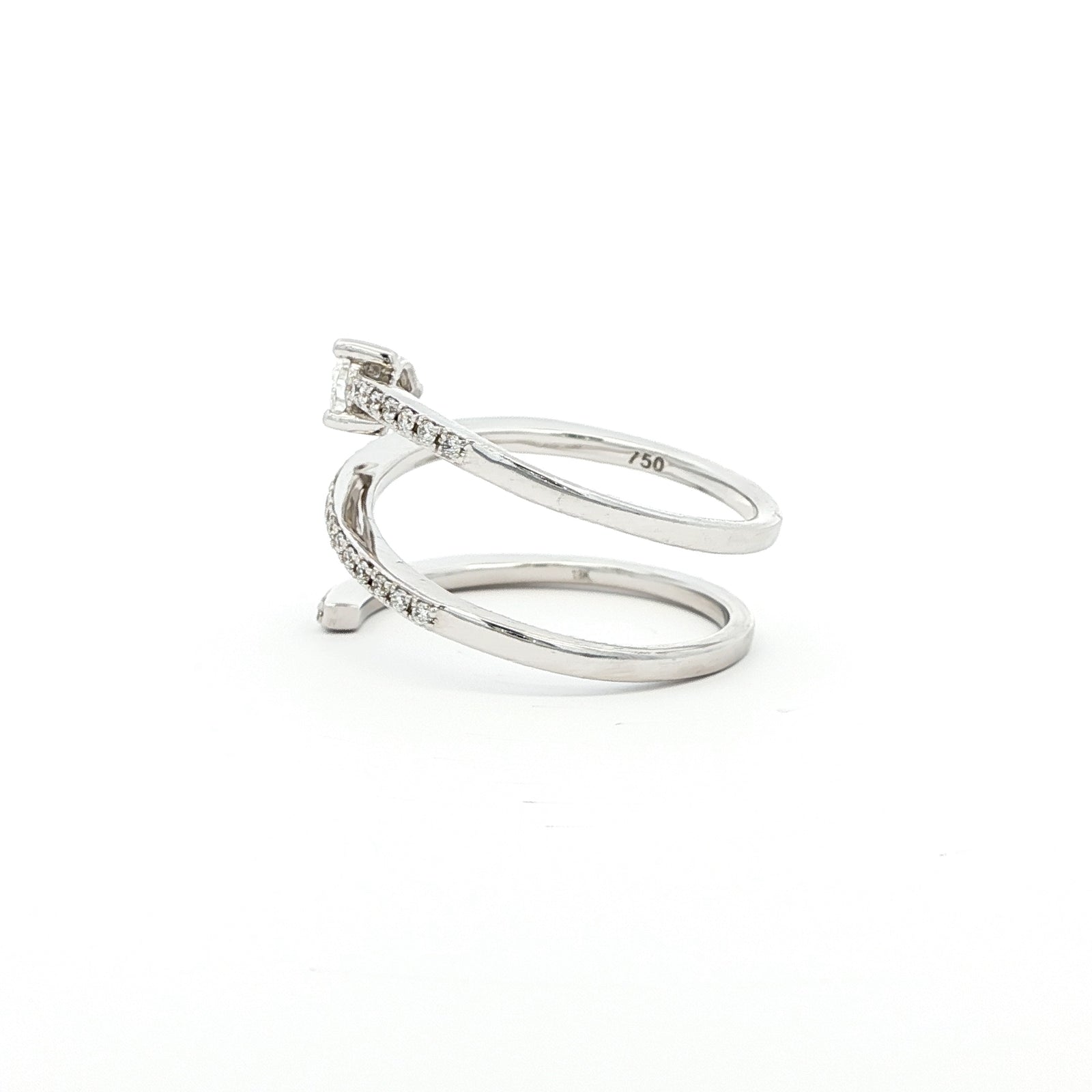 This 18K White Gold ring showcases a pear-cut diamond, set in a serpent-shaped band adorned with sparkling diamonds. A timeless design with a touch of modern artistry!