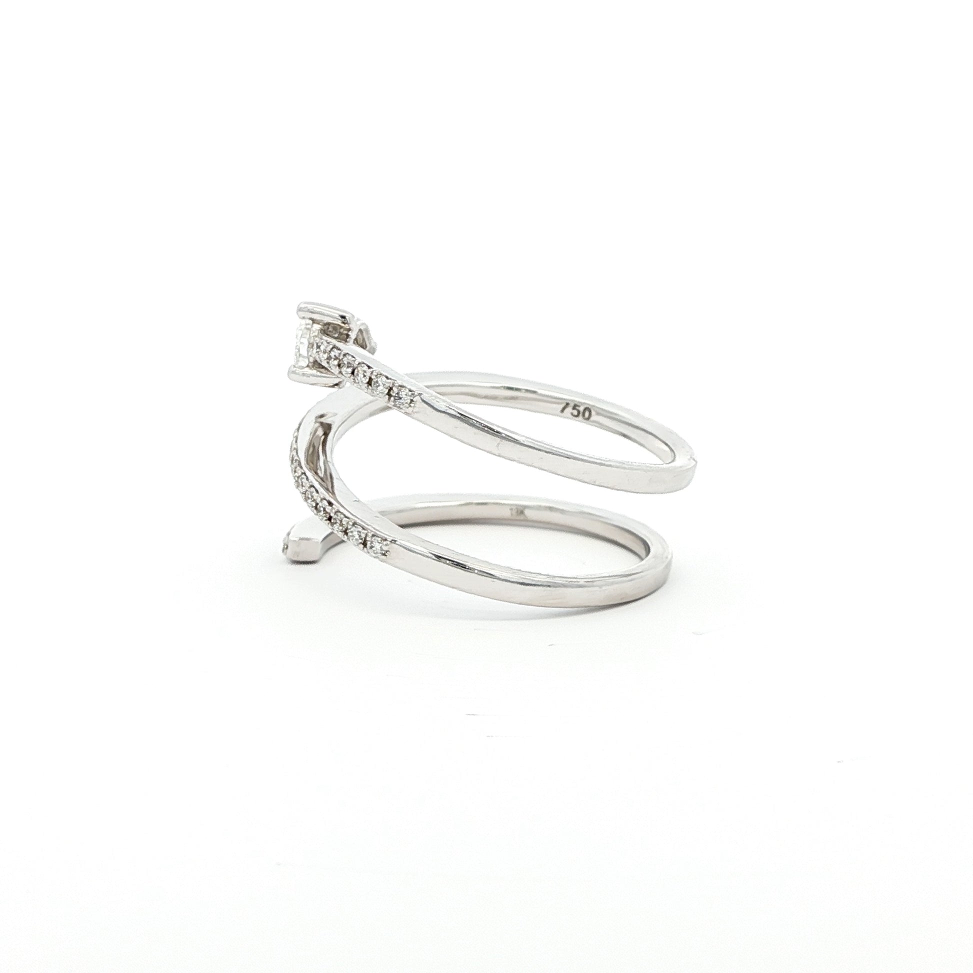 This 18K White Gold ring showcases a pear-cut diamond, set in a serpent-shaped band adorned with sparkling diamonds. A timeless design with a touch of modern artistry!