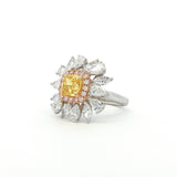 The sunflower-inspired Lumine ring is crafted in 18K tri-color gold (White, Yellow, and Rose Gold). At the centre is a fancy yellow cushion-cut diamond set in Yellow Gold. Surrounding it is a halo of pink diamonds set in Rose Gold. Completing the bloom are "petals" of white diamond set in White Gold. The result is a bold and captivating dual-tone statement piece, perfect for adding a touch of glamour to any evening look.