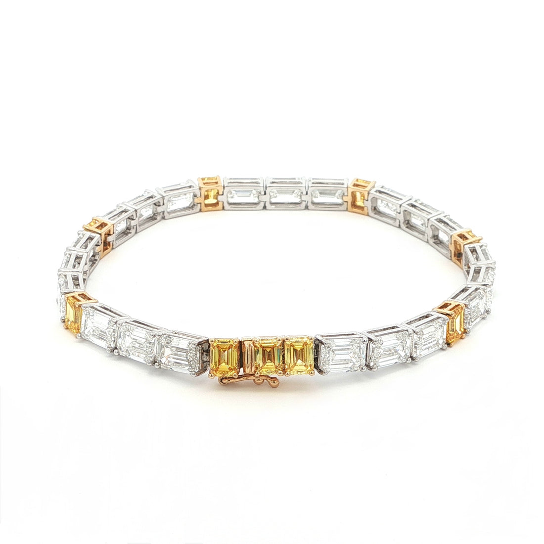 18K White & Yellow Gold Emerald-Cut Lab-Grown Diamond Tennis Bracelet 

An endless line of emerald-cut diamonds—white stones encircle the tennis-band, interspersed by six yellow emerald-cut accents. Set in a dual-tone 18K White and Yellow Gold setting, it delivers seamless sparkle and modern luxury for every occasion.