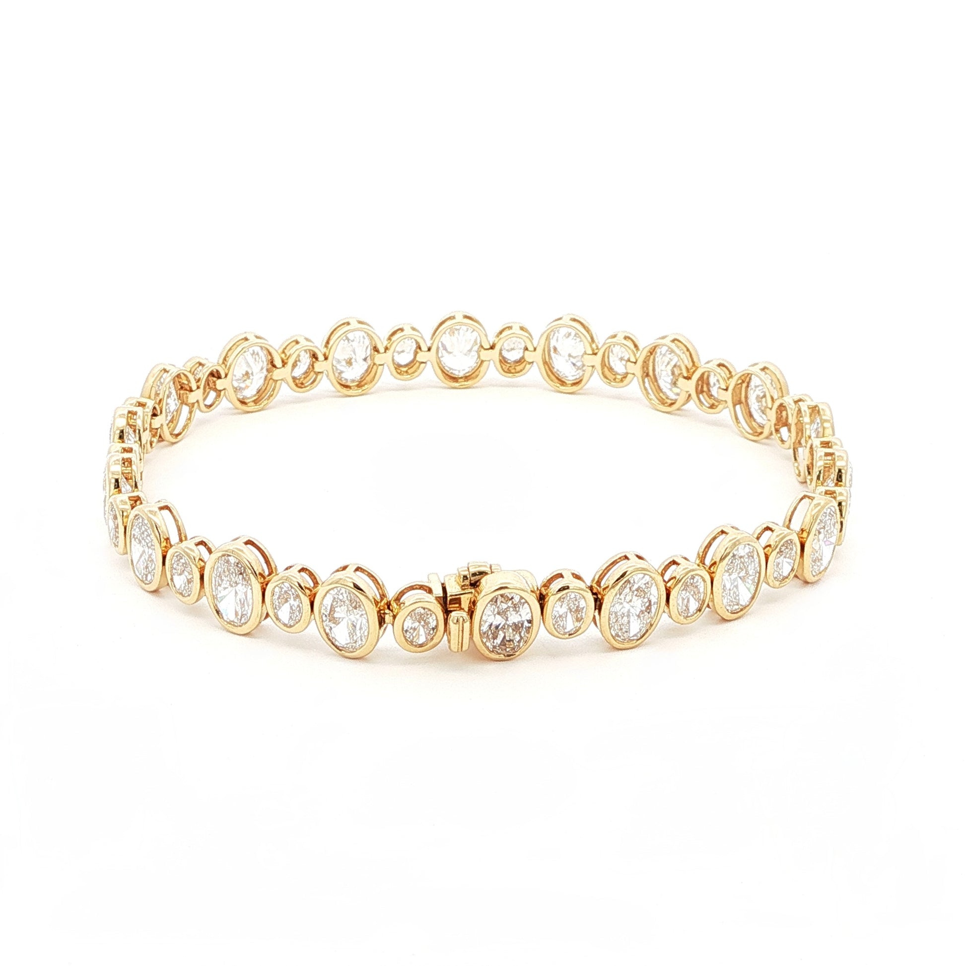 18K Yellow Gold Oval Cut Bezel Set Lab-Grown Diamond Bracelet

A seamless line of Oval-cut Lab-Grown Diamonds, alternating between small and larger stones, forms this exquisite tennis bracelet. Crafted in 18K Yellow Gold, each diamond is securely bezel-set to maximize sparkle and preserve a clean, continuous glow. Timeless yet contemporary, this bracelet pairs modern brilliance with everyday luxury, making it the perfect addition to your jewelry collection.