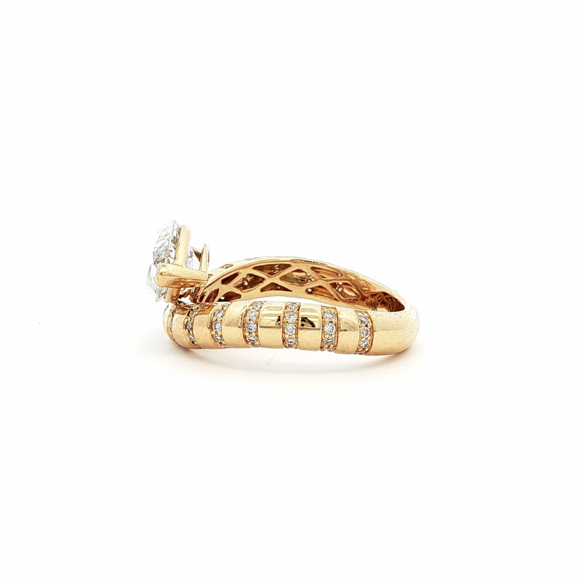 This 18K Yellow Gold ring showcases a Marquise centre stone set on a bold band, decorated with sparkling diamonds. Its exquisite craftsmanship and sophisticated design make it the perfect statement piece for any look!