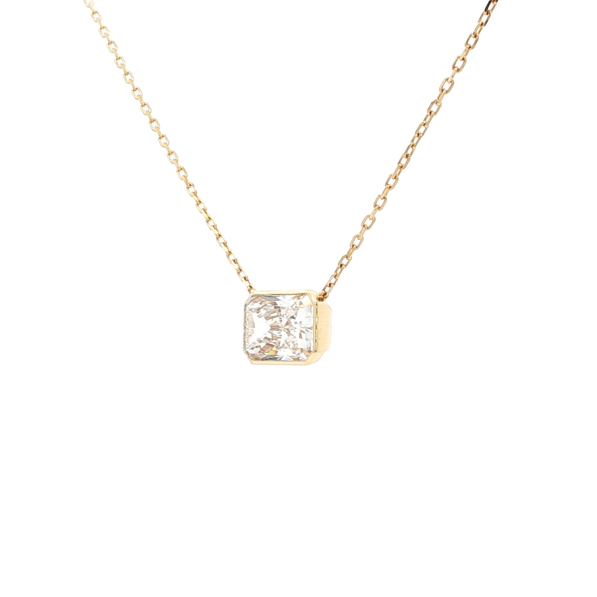 Lab-grown radiant-cut diamond pendant necklace in 18k yellow gold, bezel set. 
