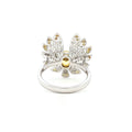 This 18K Yellow Gold ring exudes luxury, showcasing a yellow oval-cut diamond centre with a delicate floral-inspired halo adorned with white and yellow diamonds. The meticulous craftsmanship makes it a standout piece, perfect for adding a touch of glamor to your look!