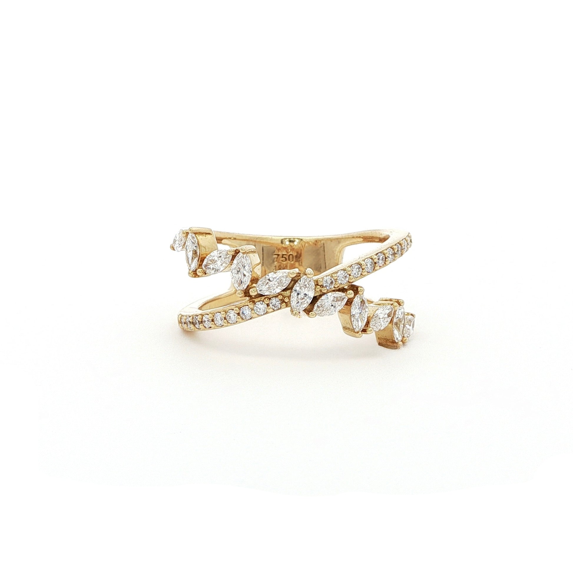This 18K Yellow Gold ring features a unique cross wrap design adorned with Marquise and Pavé diamonds. The intricate detailing and elegant curves make it a perfect accessory for any occasion, whether it's a formal event or a casual outing.&nbsp;