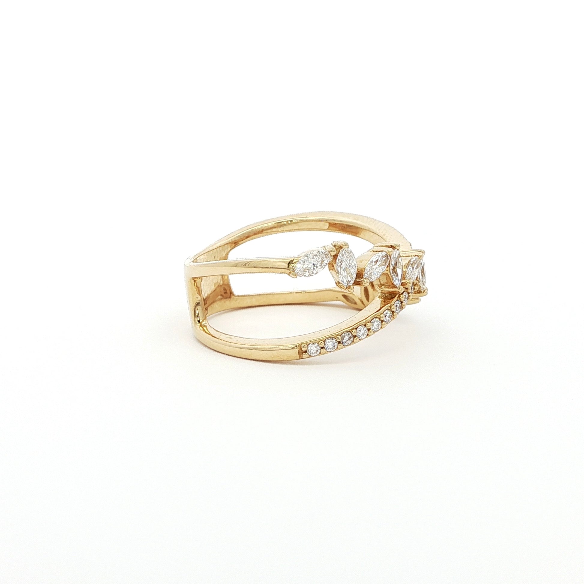 This 18K Yellow Gold ring features a unique cross wrap design adorned with Marquise and Pavé diamonds. The intricate detailing and elegant curves make it a perfect accessory for any occasion, whether it's a formal event or a casual outing.