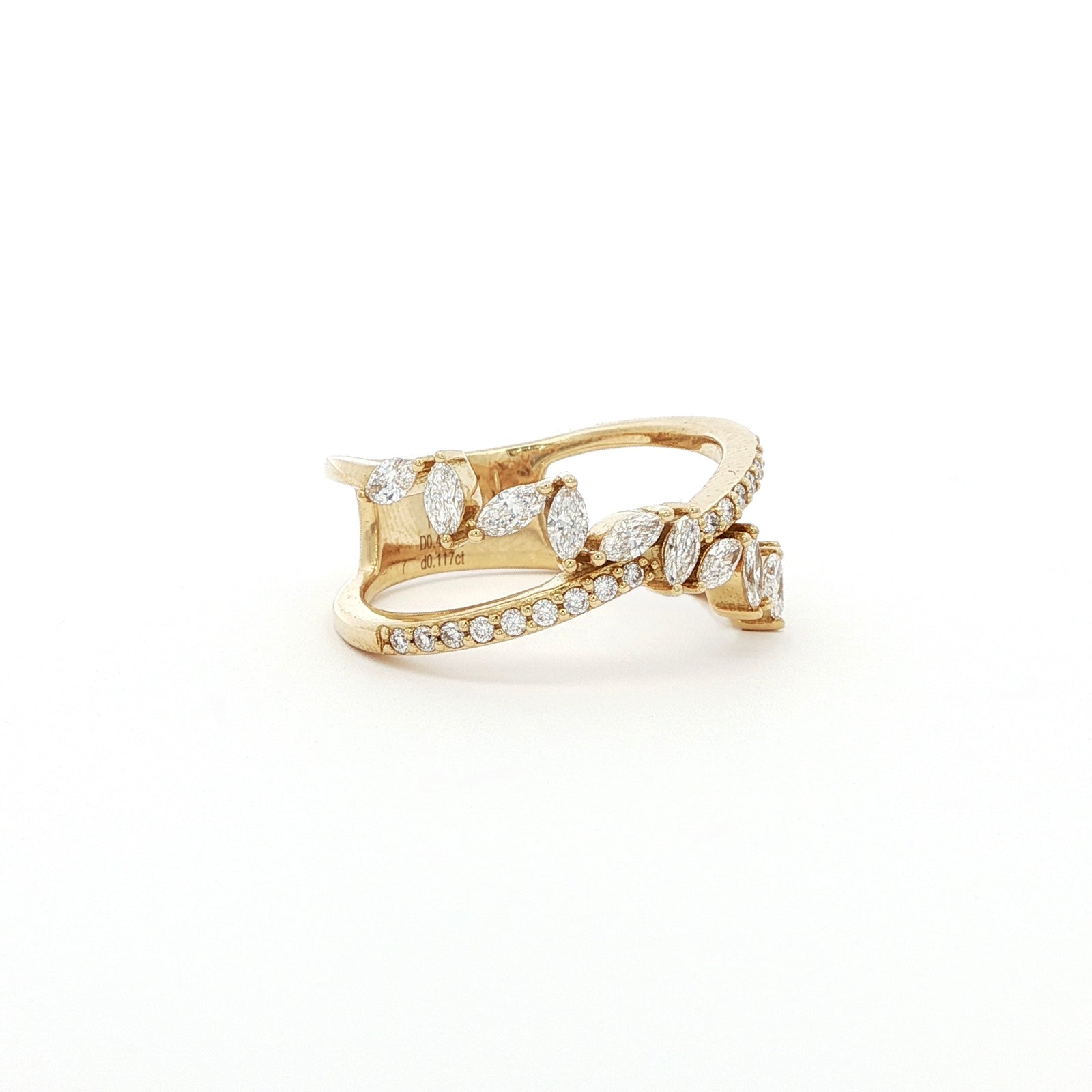 This 18K Yellow Gold ring features a unique cross wrap design adorned with Marquise and Pavé diamonds. The intricate detailing and elegant curves make it a perfect accessory for any occasion, whether it's a formal event or a casual outing.