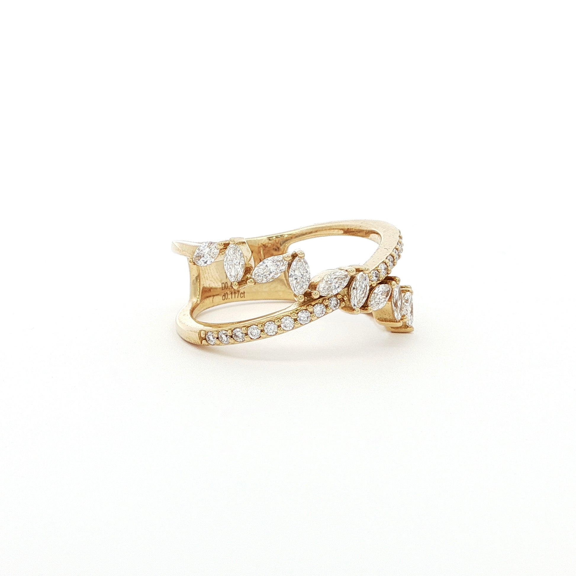 This 18K Yellow Gold ring features a unique cross wrap design adorned with Marquise and Pavé diamonds. The intricate detailing and elegant curves make it a perfect accessory for any occasion, whether it's a formal event or a casual outing.