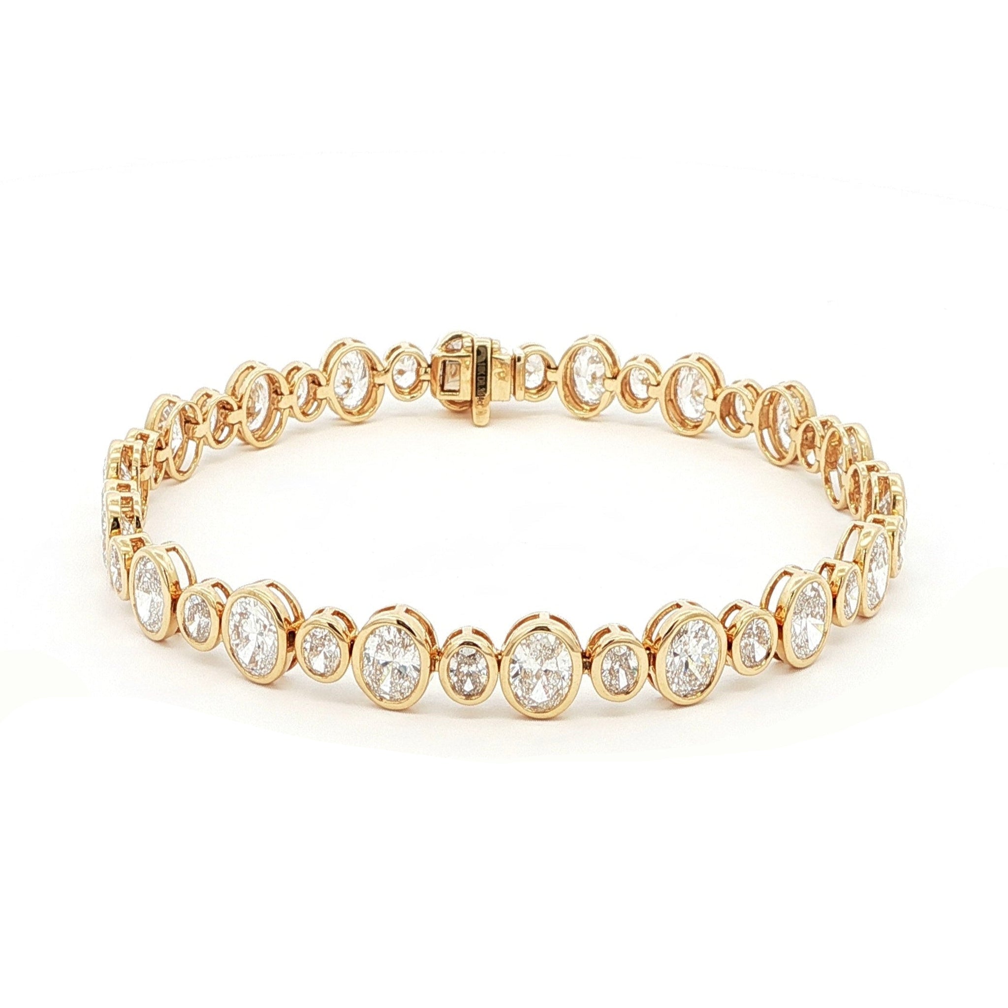 18K Yellow Gold Oval Cut Bezel Set Lab-Grown Diamond Bracelet

A seamless line of Oval-cut Lab-Grown Diamonds, alternating between small and larger stones, forms this exquisite tennis bracelet. Crafted in 18K Yellow Gold, each diamond is securely bezel-set to maximize sparkle and preserve a clean, continuous glow. Timeless yet contemporary, this bracelet pairs modern brilliance with everyday luxury, making it the perfect addition to your jewelry collection.