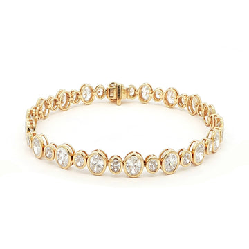 18K Yellow Gold Oval Cut Bezel Set Lab-Grown Diamond Bracelet

A seamless line of Oval-cut Lab-Grown Diamonds, alternating between small and larger stones, forms this exquisite tennis bracelet. Crafted in 18K Yellow Gold, each diamond is securely bezel-set to maximize sparkle and preserve a clean, continuous glow. Timeless yet contemporary, this bracelet pairs modern brilliance with everyday luxury, making it the perfect addition to your jewelry collection.