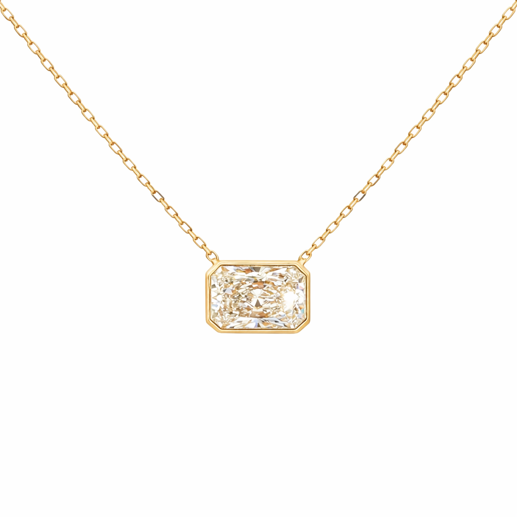 Lab-grown radiant-cut diamond pendant necklace in 18k yellow gold, bezel set. 