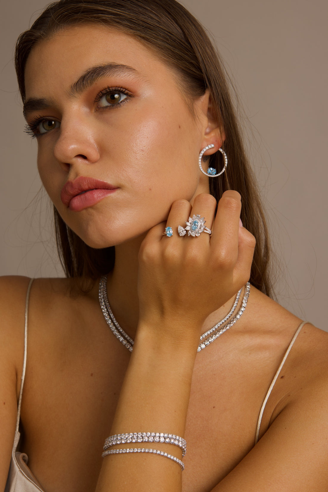 This 18K White Gold Ring showcases an exquisite floral design with a captivating oval-cut blue diamond centre, framed with white diamond "petals". A timeless embodiment of luxury and sophistication, perfect for making a statement!