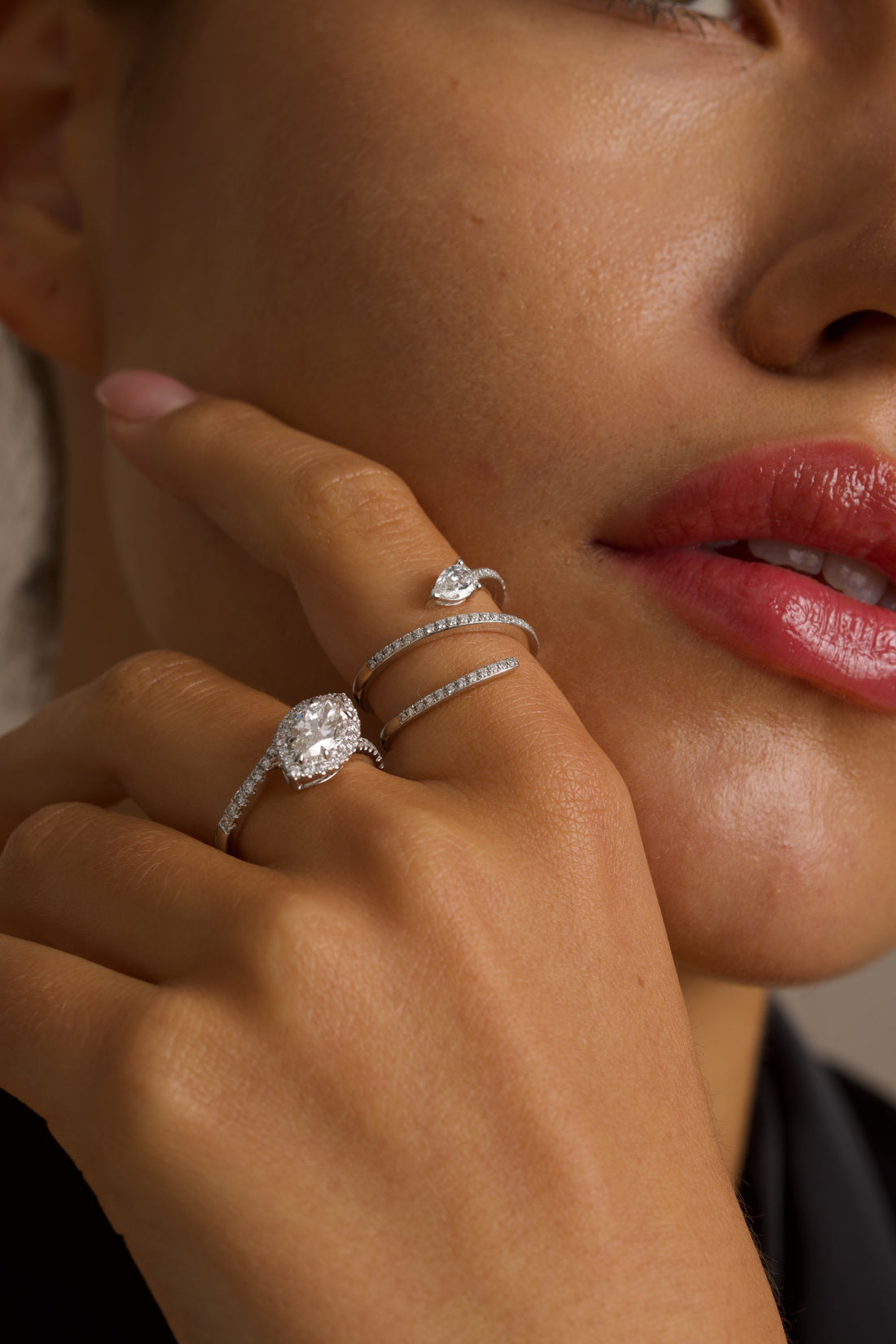 This 18K White Gold ring showcases a pear-cut diamond, set in a serpent-shaped band adorned with sparkling diamonds. A timeless design with a touch of modern artistry!
