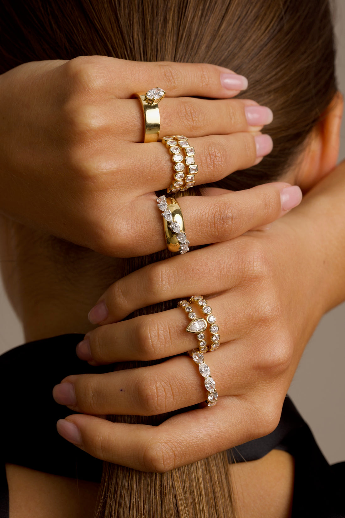 18K Yellow Gold half-eternity ring featuring bezel-set emeralds in a playful high-low pattern. A modern twist on the classic eternity band, designed for effortless sparkle and everyday wear.