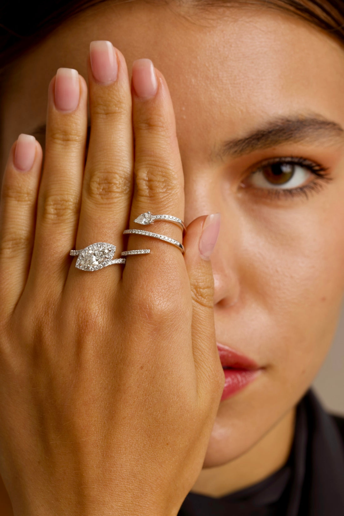 This 18K White Gold features a Marquise centre with a perfectly studded halo. The band enhances the centre diamond, creating an unforgettable piece!&nbsp;