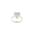 Crafted in 18K White Gold, this ring features a brilliant heart-shaped lab-grown diamond embraced by a glittering halo. Beneath the centre stone, a hidden halo adds an extra tier of light, the double-halo effect creates depth and radiance, making this ring a true statement of elegance.