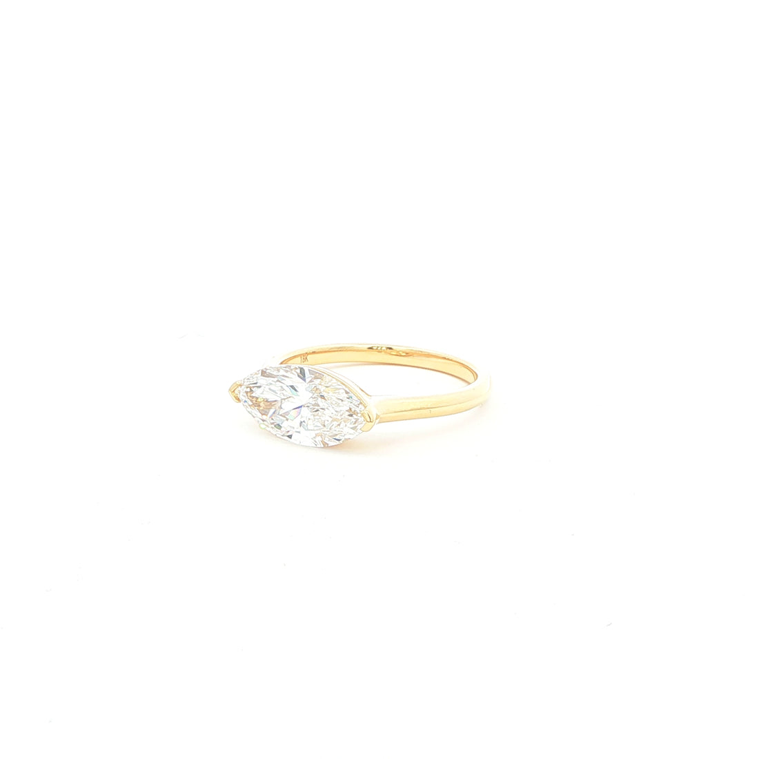 Marquise lab-grown diamond, east-west setting, half bezel in 18k yellow gold. 