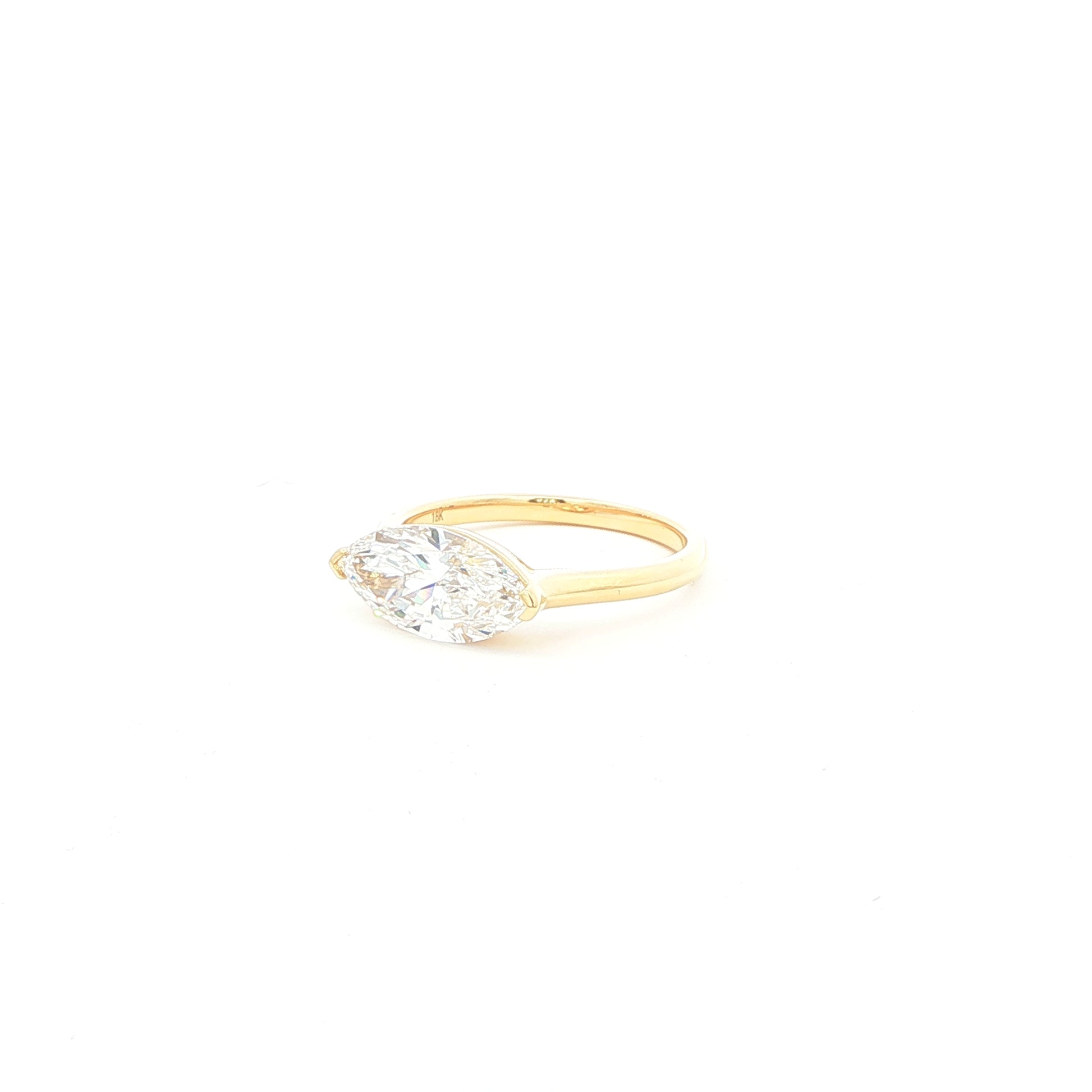 Marquise lab-grown diamond, east-west setting, half bezel in 18k yellow gold. 