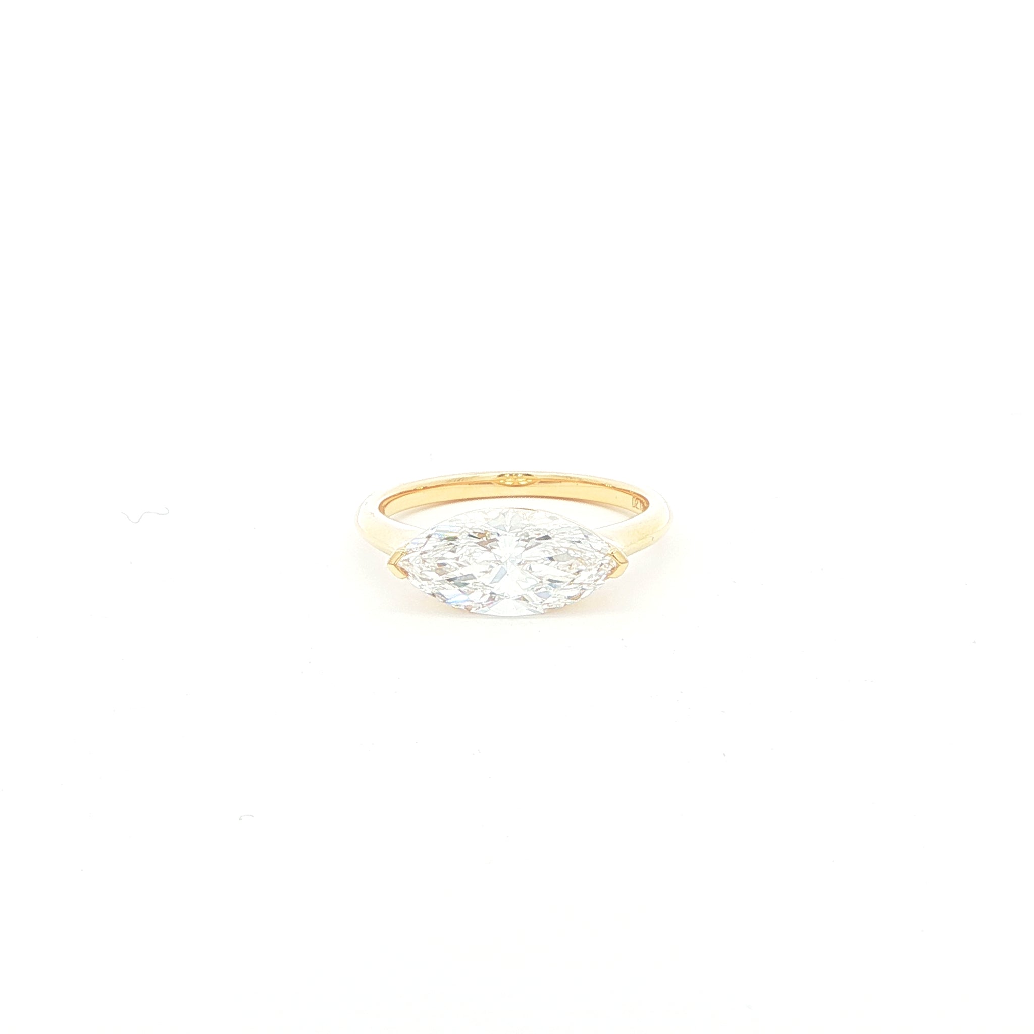 Marquise lab-grown diamond, east-west setting, half bezel in 18k yellow gold. 