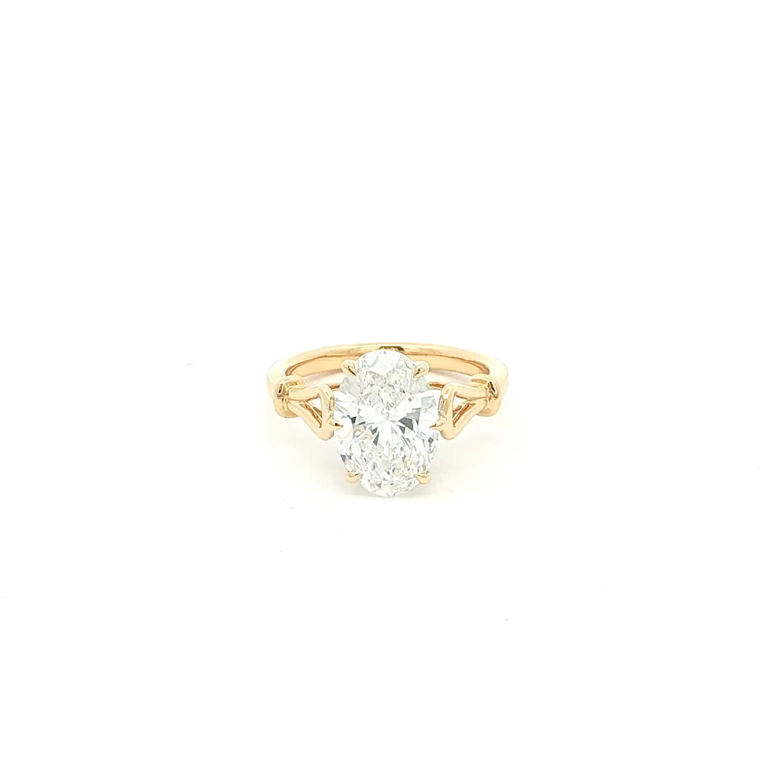 Oval solitaire lab-grown diamond ring in tapered cathedral setting, 18k yellow gold. 