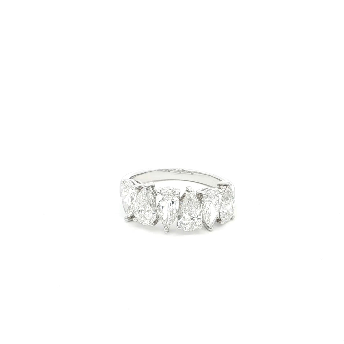 Pear cut lab grown diamond ring in half eternity style, 18k white gold.