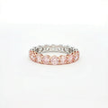 Two-tone ring with pink and silver stones on a white background