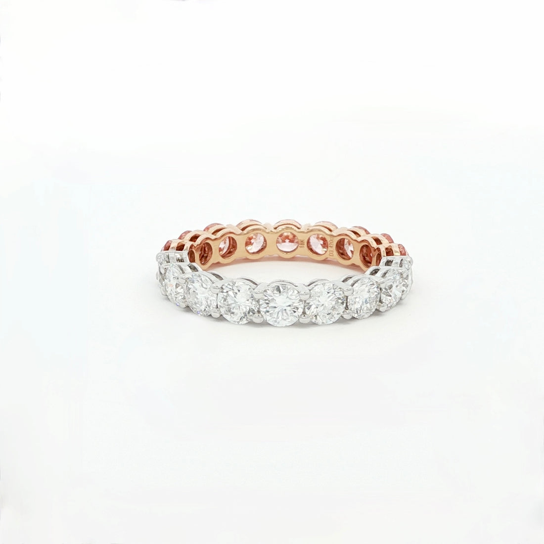 Luxury two-tone eternity band in 18K white and rose gold with round pink and white diamonds