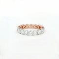 Rose gold and silver ring with diamonds on a white background