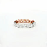 Rose gold and silver ring with diamonds on a white background