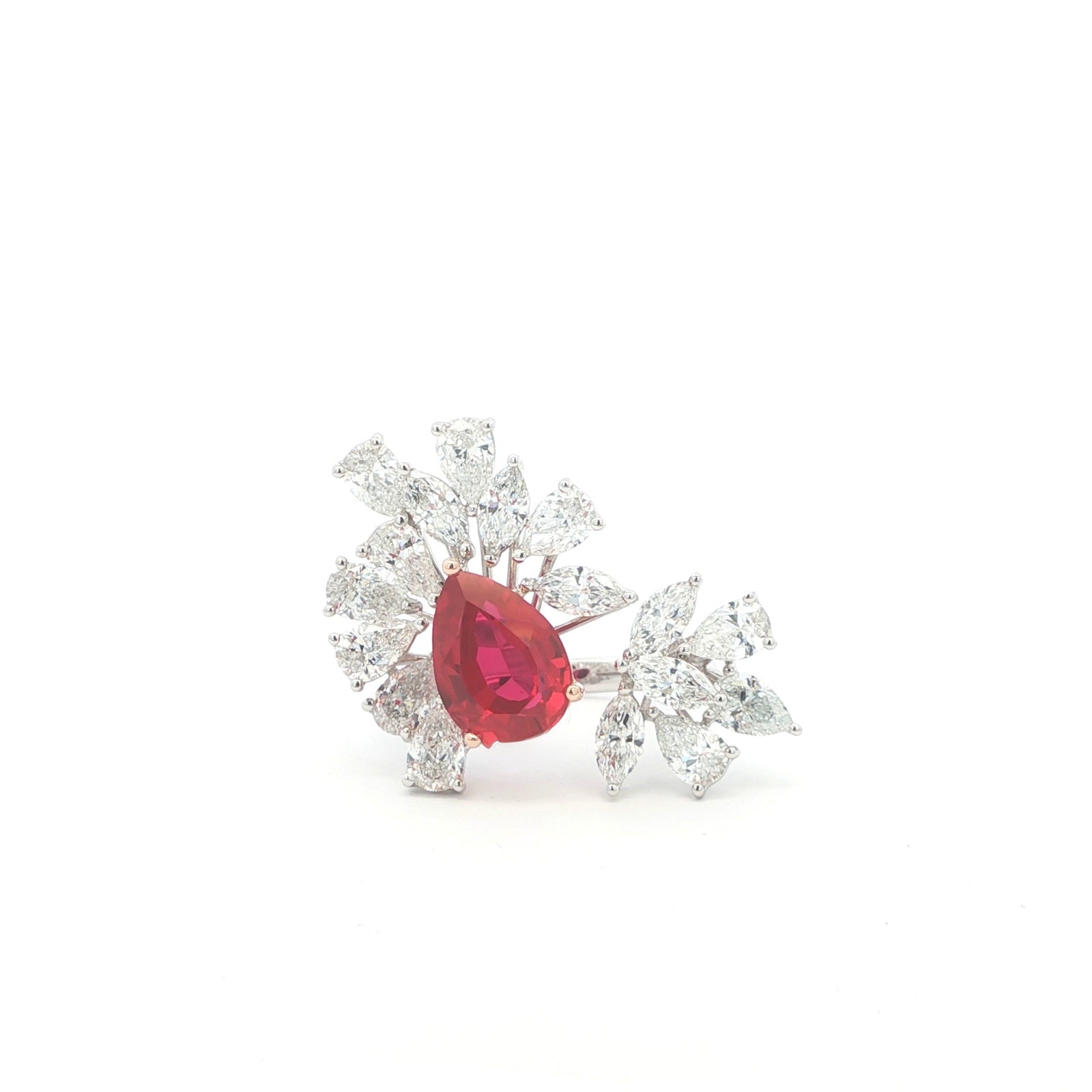 Lab grown ruby ring with clusters of marquise and pear diamonds in an open style setting. Set in a unique and luxurious combination of 14K White and Rose Gold.