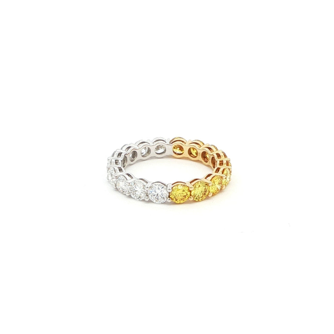 Luxury two-tone eternity band in 18K white and rose gold with round yellow and white diamonds